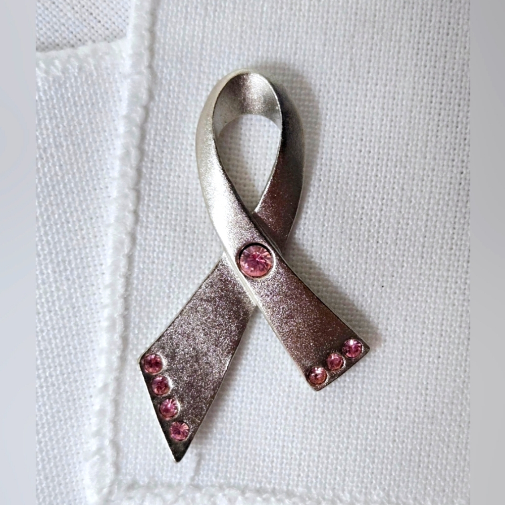Vintage Avon Product. A silver-tone breast cancer awareness ribbon pin